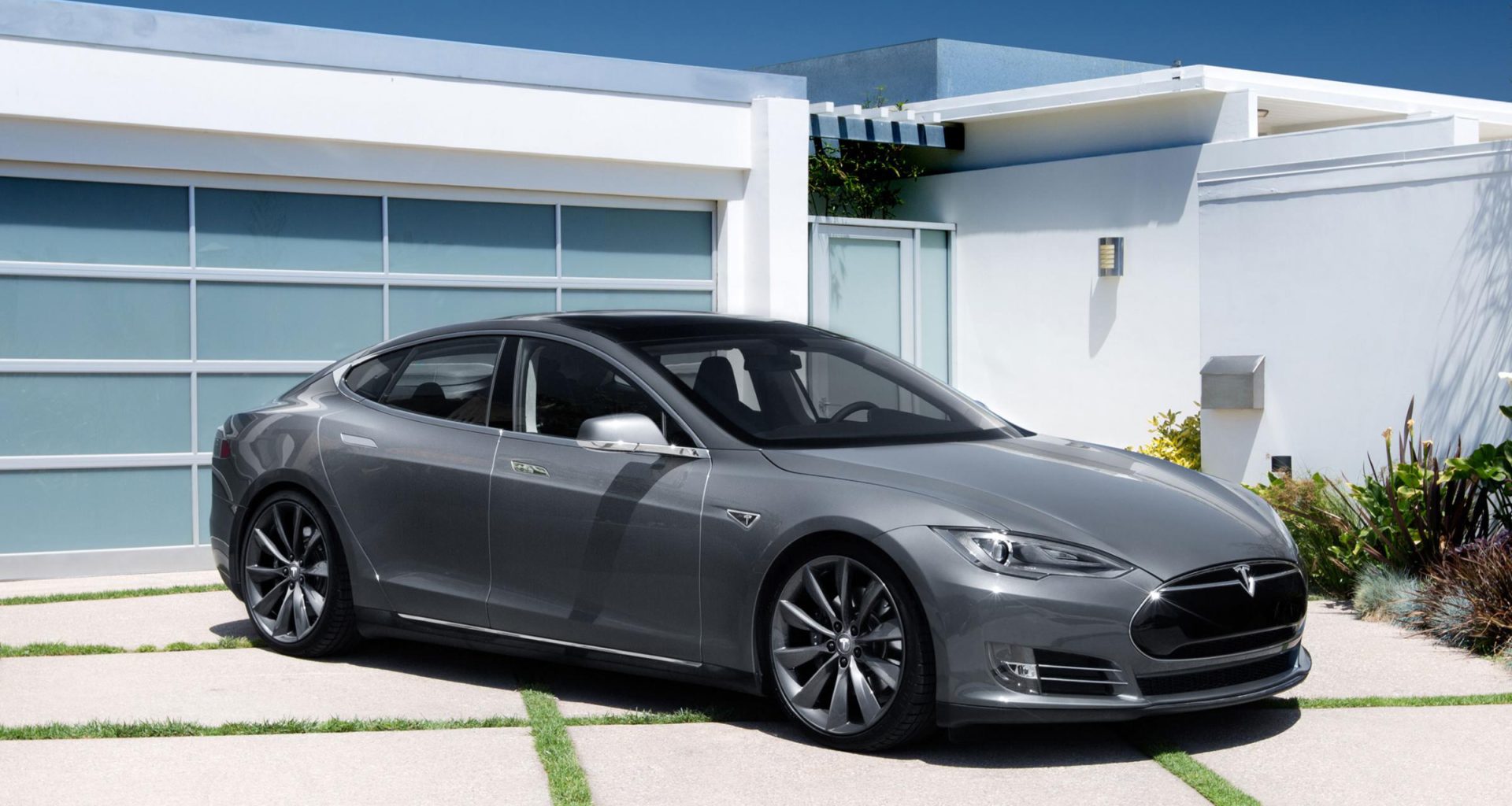 A Tesla Model S parked in the driveway